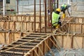 Group of construction workers fabricating ground beam formwork Royalty Free Stock Photo